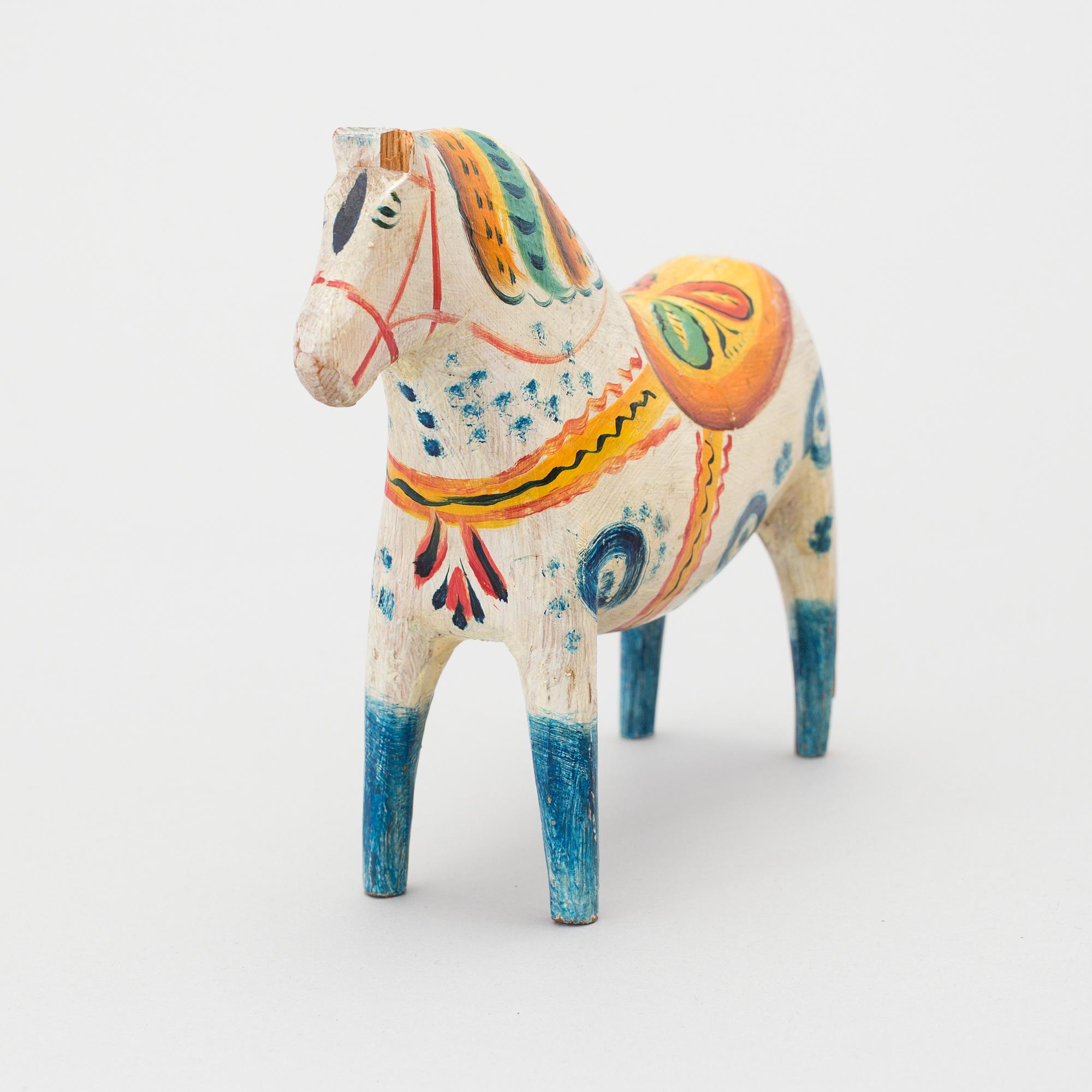 A painted folk art dala horse first half of the 20th century.