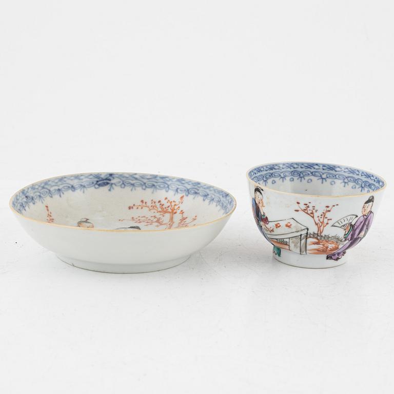 A pair of Famille rose porcelain plates, a cup with saucer and a blue and white charger, China, 18th century.