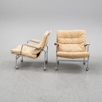 Bruno Mathsson, a pair of easy chairs and a coffee table, 'Karin', Dux, second half of the 20th Century.