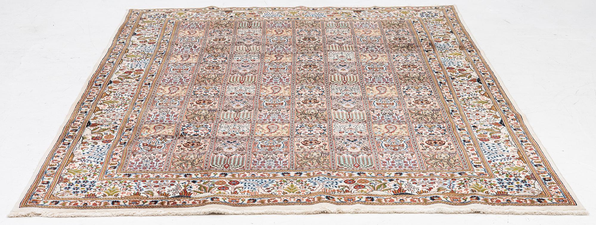 A Moud carpet, part silk, approx. 285 x 195 cm.