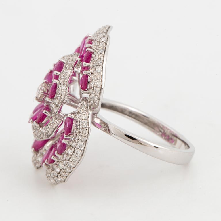 Ruby and brilliant-cut diamond flower ring.