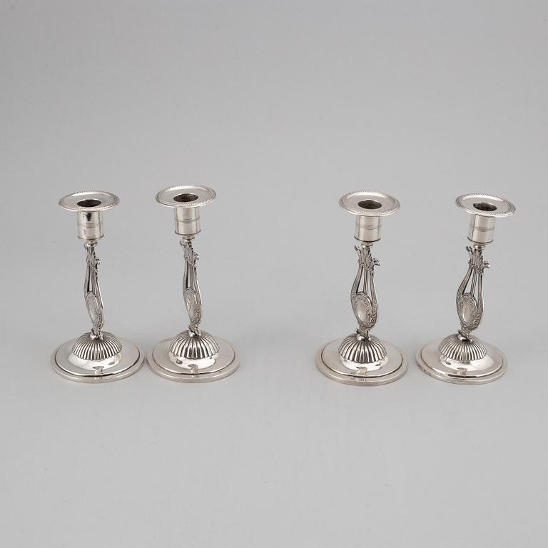 A Swedish 19th century matched set of four silver candlesticks, mark of Johan Petter Grönvall, Stockholm 1824.