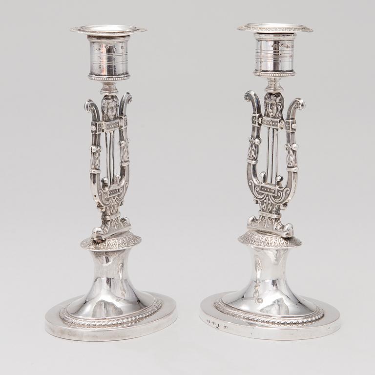 A pair of silver candlesticks marked Adolf Zethelius, Stockholm, 1816.