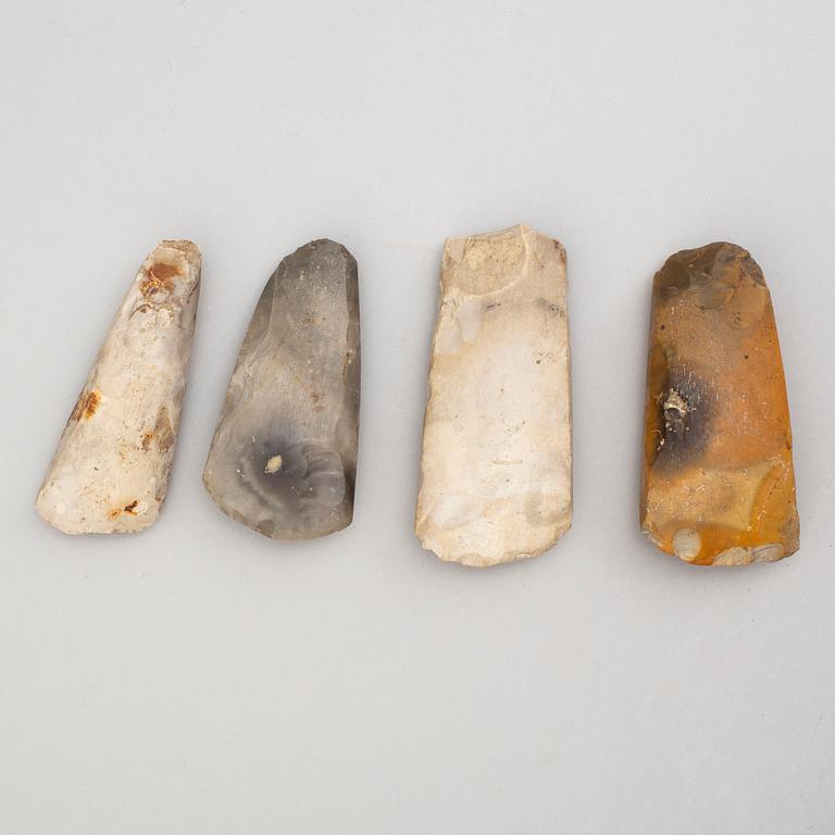 Four neolithic flint axes.