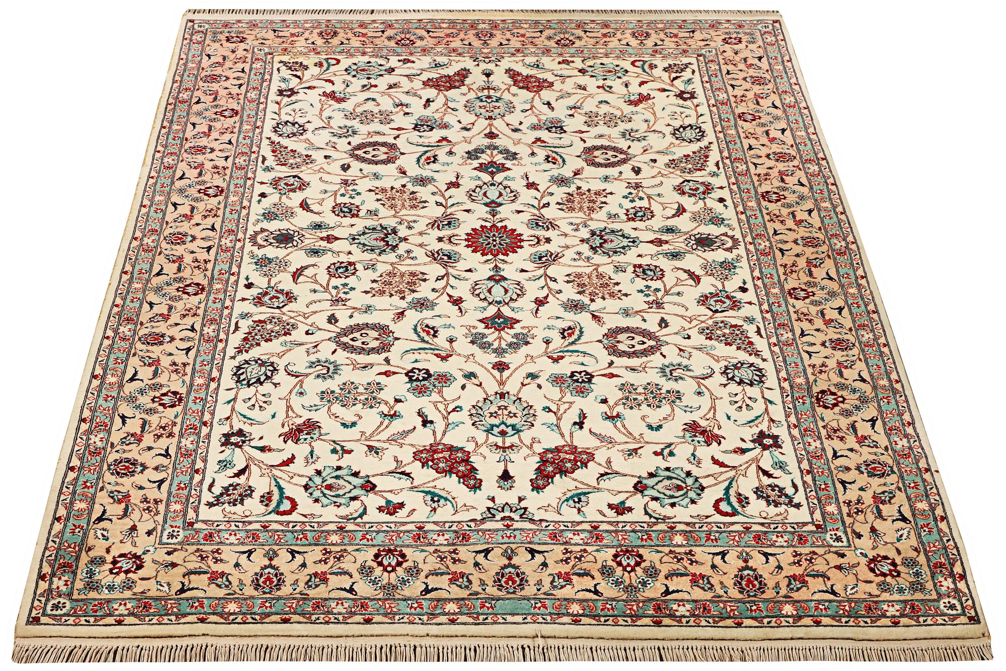 An oriental silk carpet, a. 280 x 185 cm.
