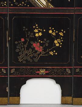 A Chinese four panel lacquer folding screen, first part of the 20th century.