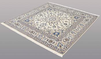 A rug, Nain part silk, ca 197 x 197 cm.