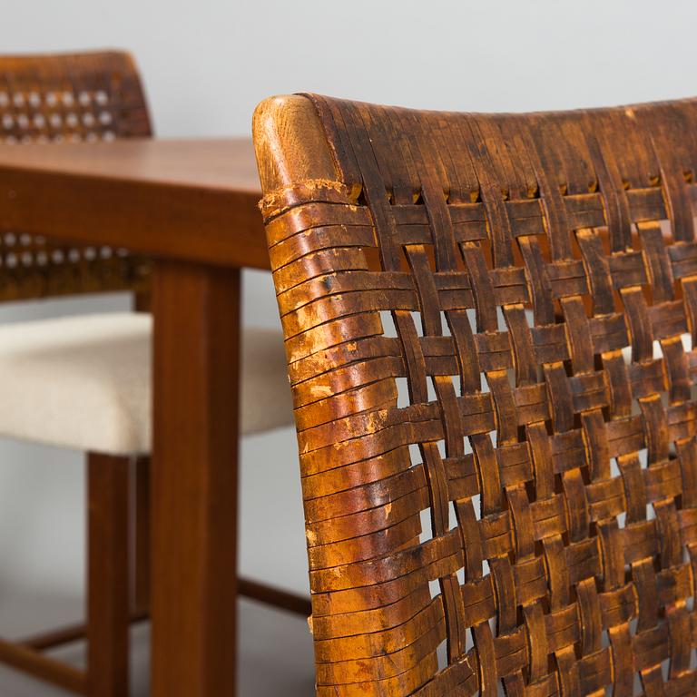 Carl Gustaf Hiort af Ornäs, a mid-20th Century dining table and eight chairs for  för HMN Huonekalu Mikko Nupponen.