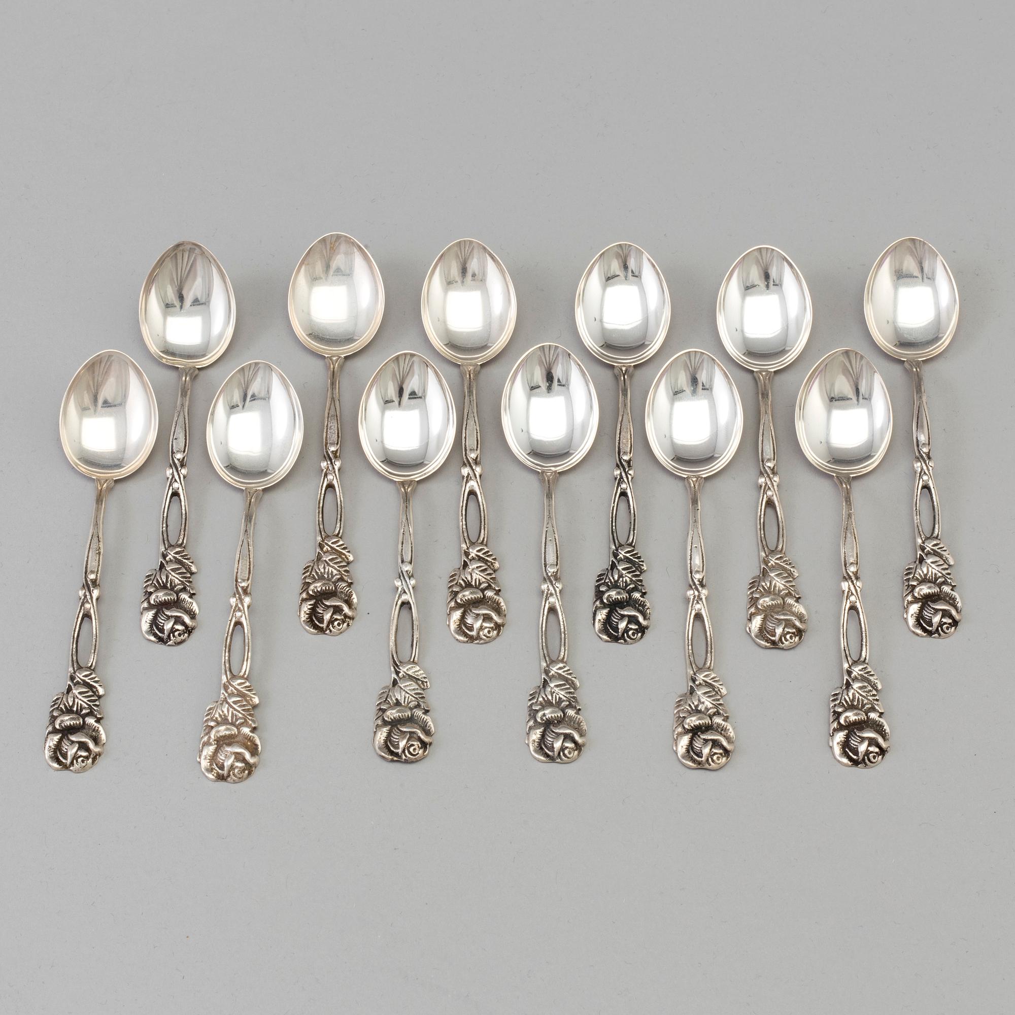 12 silver coffee spoons, import marks for Malmö, Sweden, 20th century. Weight ca 123 grams.
