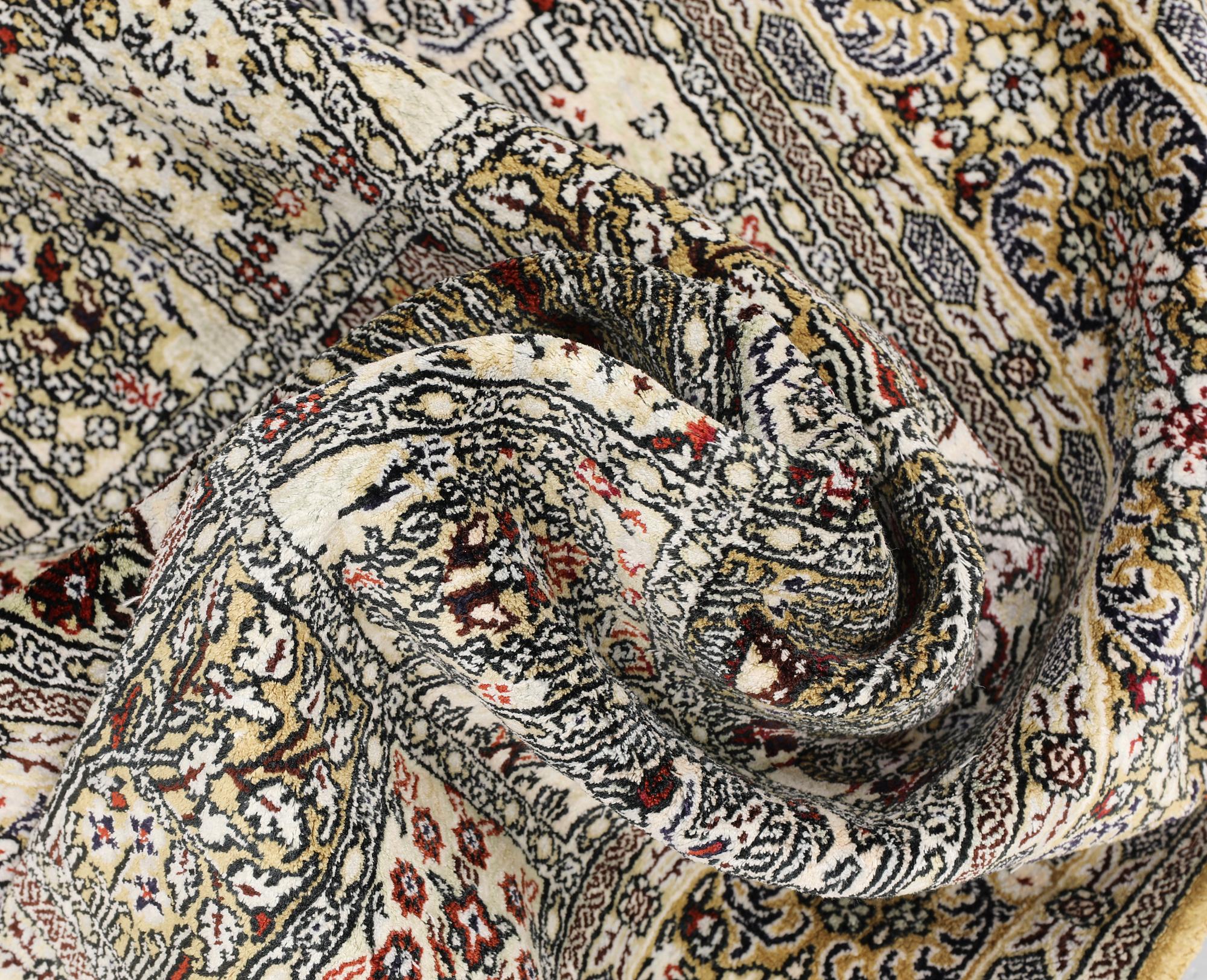An Oriental silk rug, approx. 122 x 79 cm.