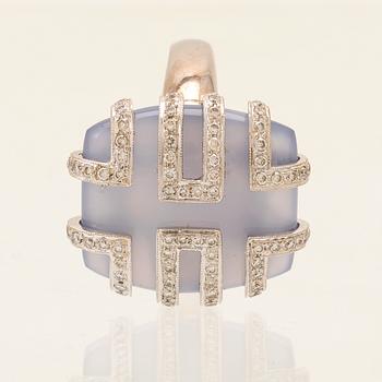 An 18K white gold ring with brilliant cut diamonds and possibly chalcedony.