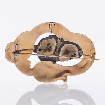 BROSCH, 18K guld med vit och blå emalj, 1800/1900 tal.