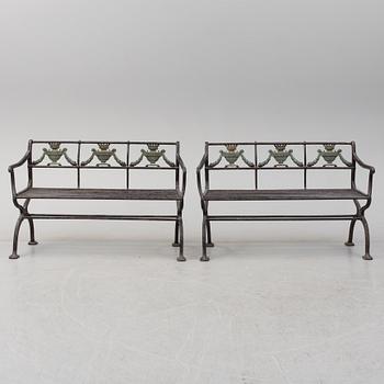 GARDEN SOFAS, a pair, cast iron, empire style, late 19th century.