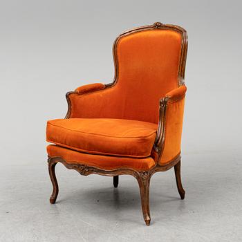 A Louis XV 18th century bergere by Jacques Malot (master in Paris 1748).