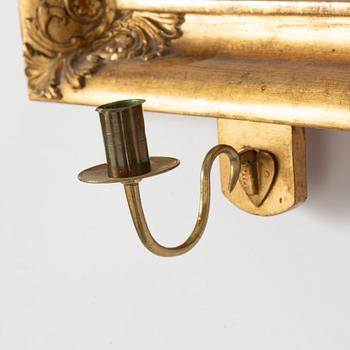 A mid 19th century mirror sconce.