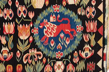 A cushion, 'Red Lion' (Rött Lejon), tapestry weave, c. 104 x 47 cm, Southwestern Scania, first part of the 19th century.
