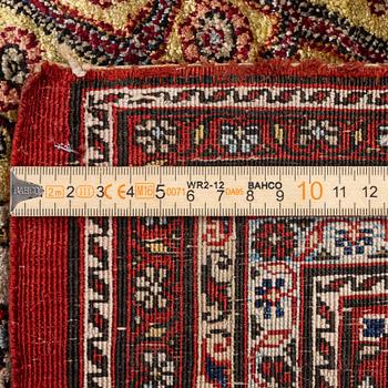 A semi-antique silk Qum rug, central Persia 221 x 138 cm.