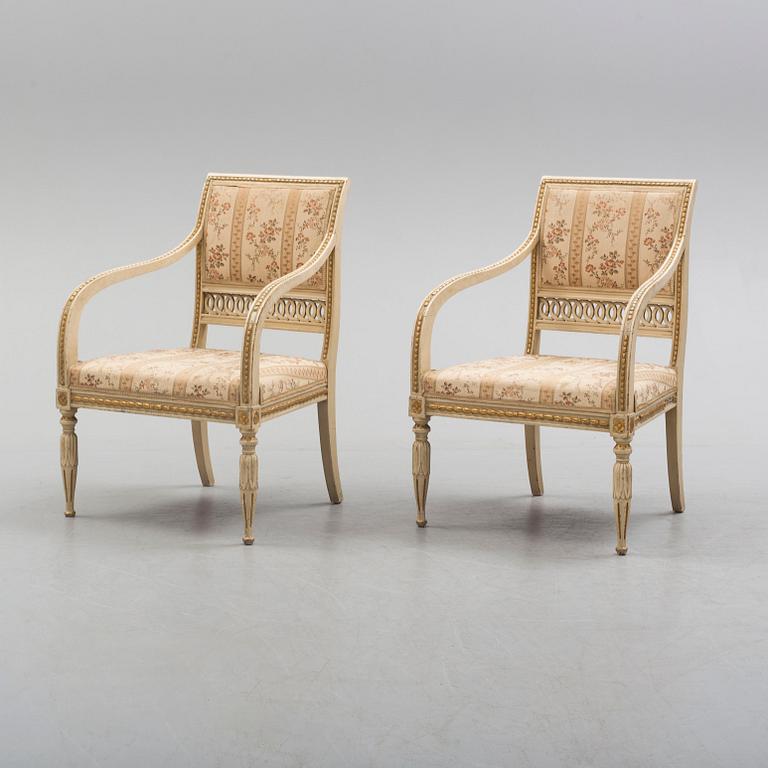 A pair of first half of the 19th century Empire arm chairs.