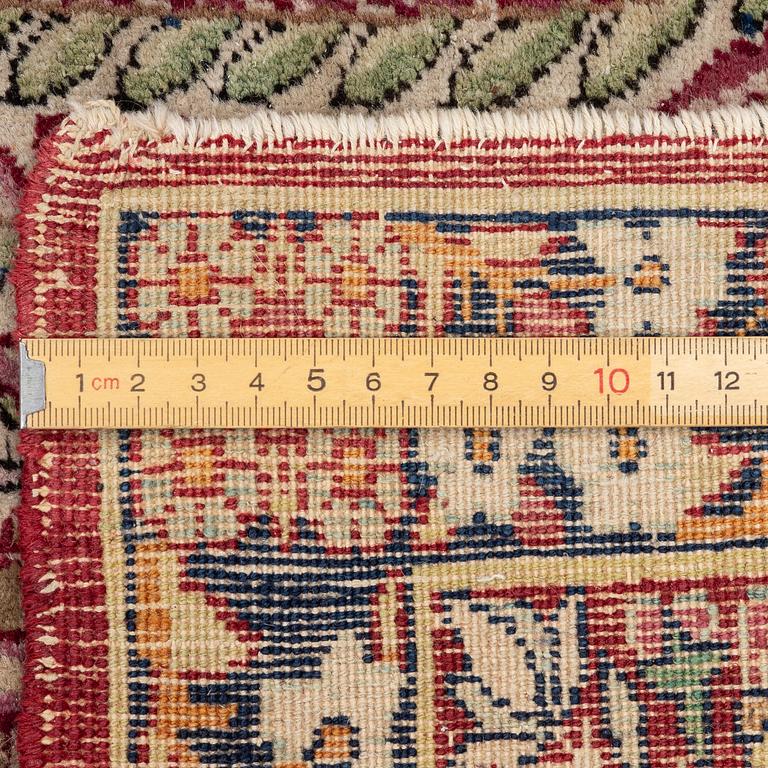 An antique Kirman rug, south Persia, c. 220 x 140 cm.