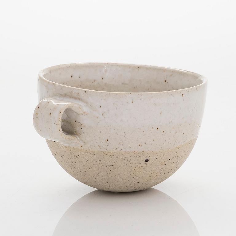 Kyllikki Salmenhaara, a stoneware tea strainer signed KS.