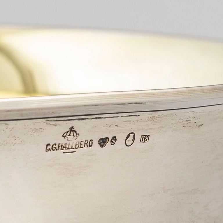 A parcel gilt silver bowl on a wooden base by CG Hallberg Stockholm 1934.