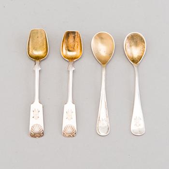 Four Russian 19th Century silver salt cellars and four Finnish 1920s parcel-gilt salt spoons.