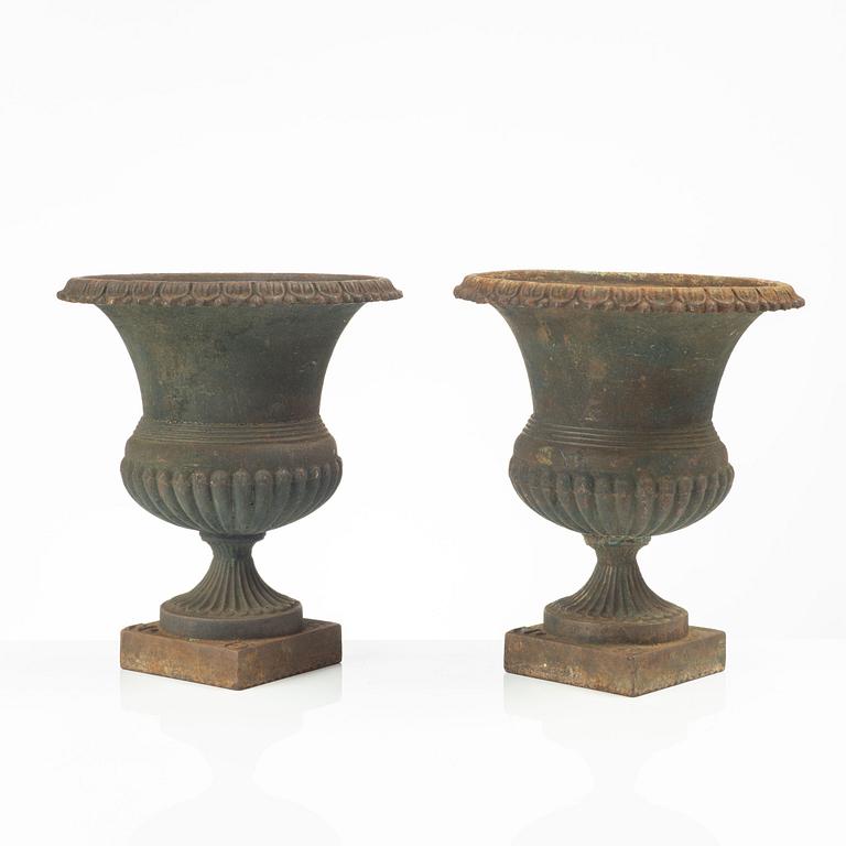 Garden urns, a pair, cast iron, marked No 15, 20th Century.