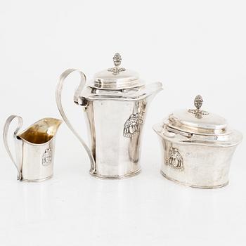 A Swedish silver coffee pot, a sugarbox and a creamer, including Gustaf Hamnqvist, Åmål 1809.