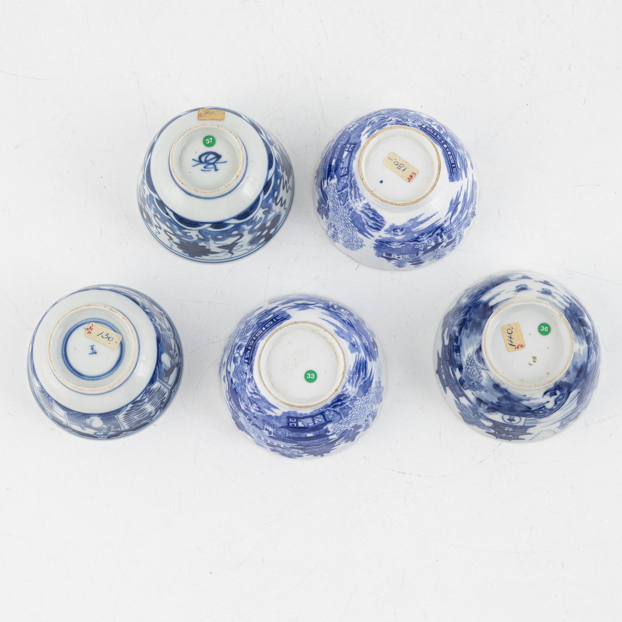 A group of thirteen cups, a bowl and a cup holder, four saucers, partly China and 18th century,