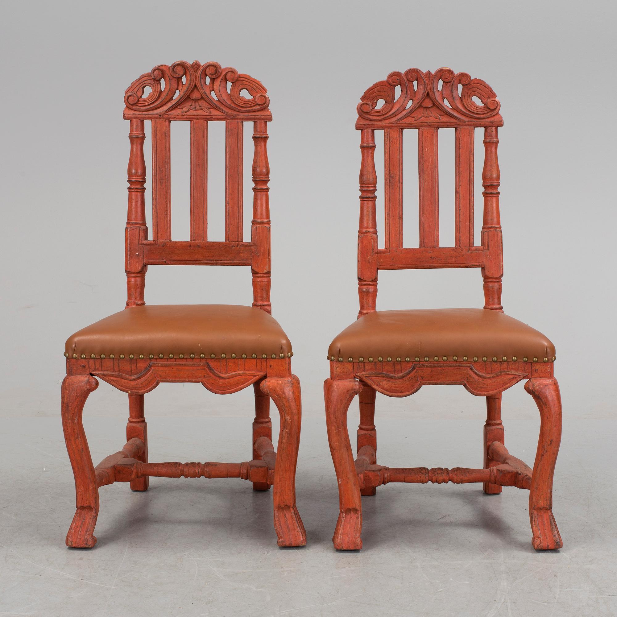 A pair of painted late baroque chairs 18th century.