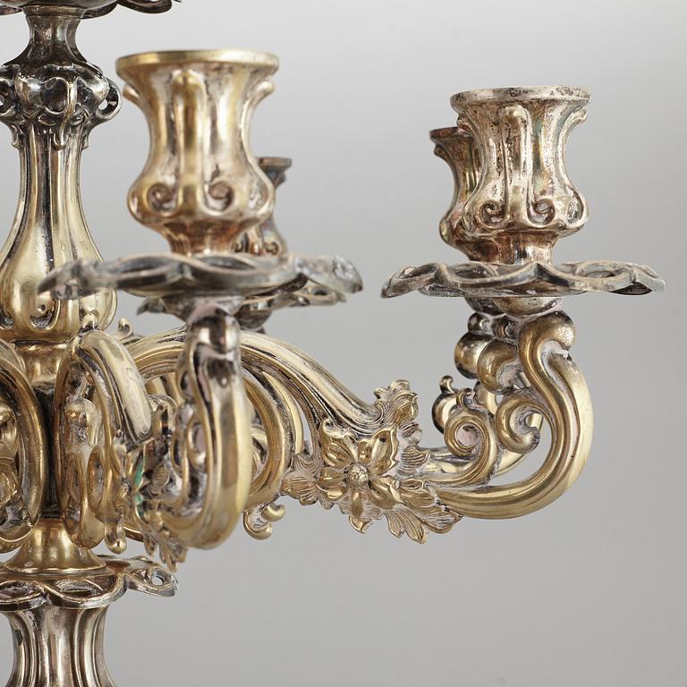 A pair of barocque style nine lights candelabra, silver plate, 20th Century.
