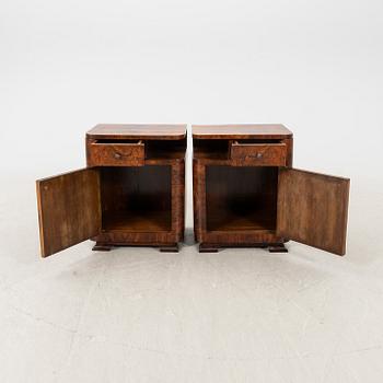 A pair of Art Deco walnut bedside tables.