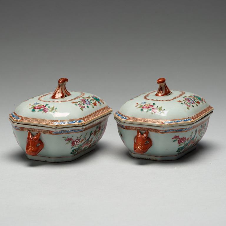 A pair of famille rose 'double peacock' tureens with cover and stands, Qing dynasty, Qianlong (1736-95).