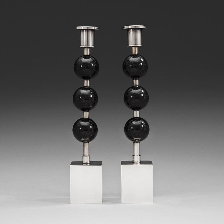 A pair of Sigurd Persson silver plated and porphyry candlesticks, Sweden.