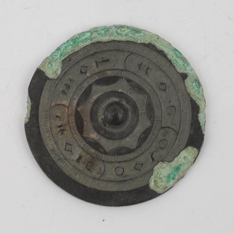 Four bronze lobed mirrors,  Han dynasty (206 B.C.-220 A.D.).