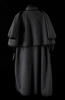 A 1970s grey wool cape by Yves Saint Laurent.