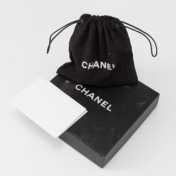 A necklace by Chanel.