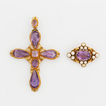 An 18K gold 19th century cross pendant and a brooch set with faceted amethysts and pearls.