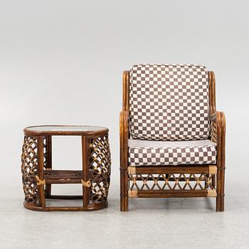 A rattan armchair and table, end of the 20th Century.