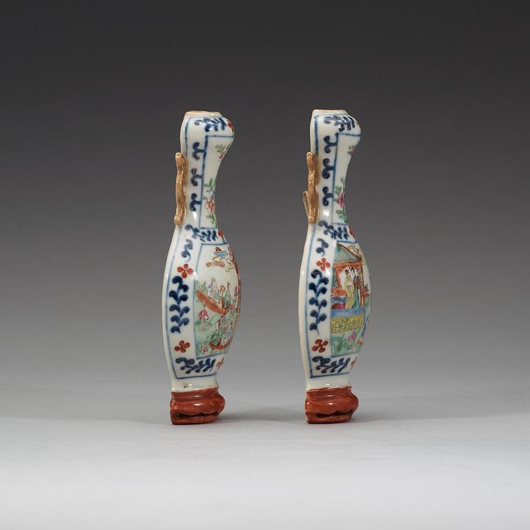 A pair of famille rose wall vases, late Qing dynasty, circa 1900.