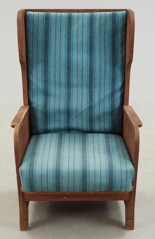 An Axel Einar Hjorth 'Lovö' stained pine armchair, Nordiska Kompaniet, Sweden 1930's.