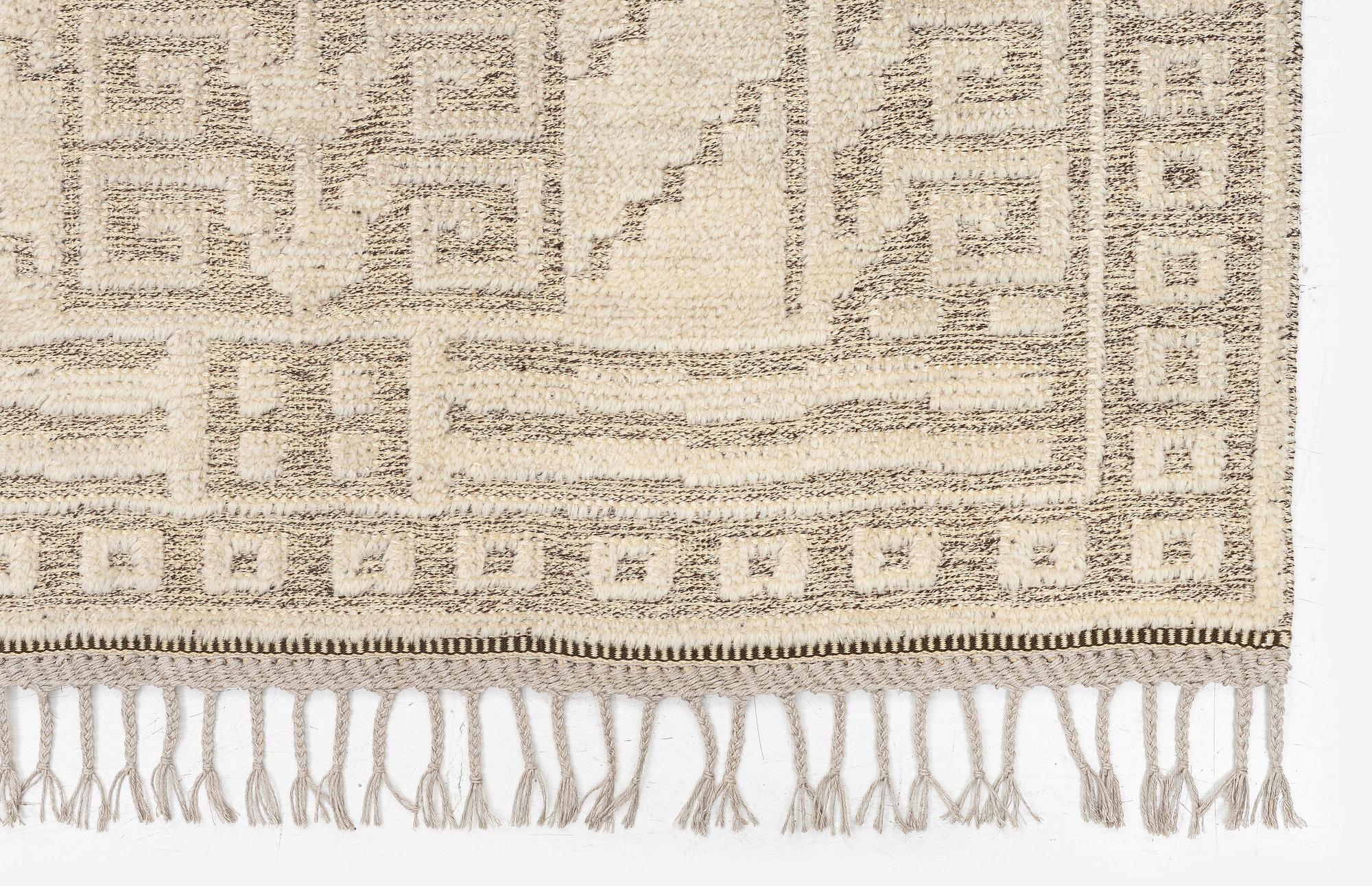 Märta Måås-Fjetterström, a 'Vita spetsporten' carpet, knotted pile in relief, c. 225 x 136 cm. signed AB MMF.