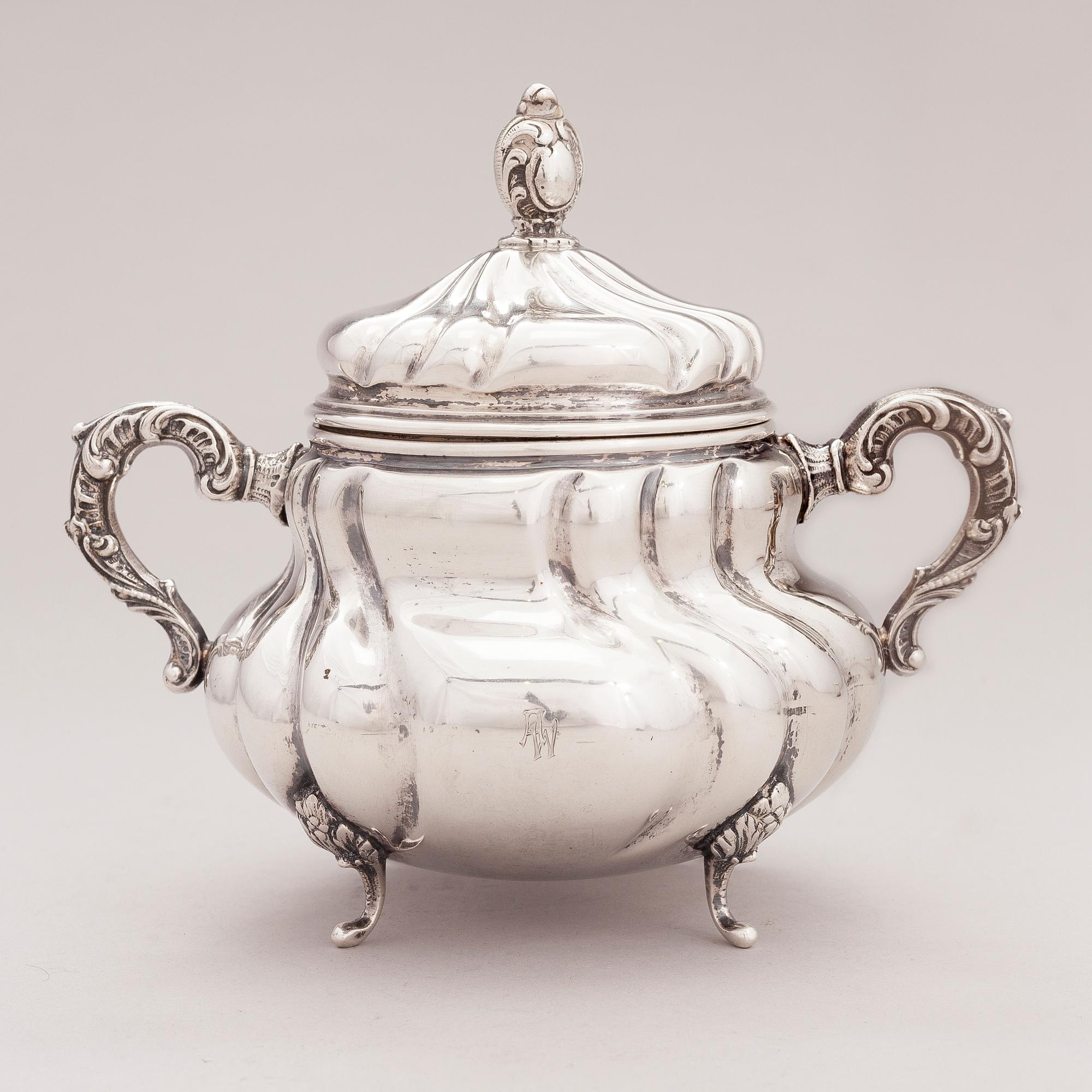 A lidded silver sugar bowl and a set of six silver bowls, Germany.