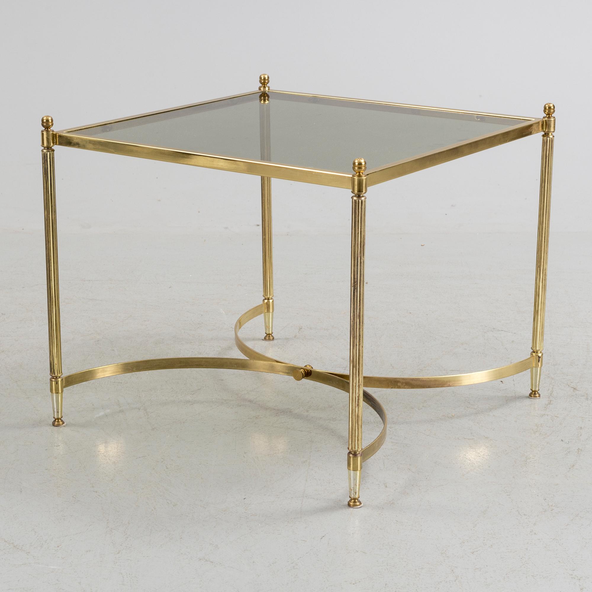 A brass and glass coffee table from the second half of the 20th century.