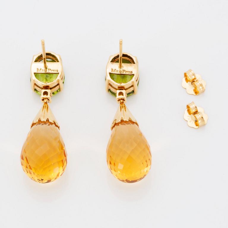 A pair of 18K gold earrings set with faceted peridots and with briolette-cut citrines.