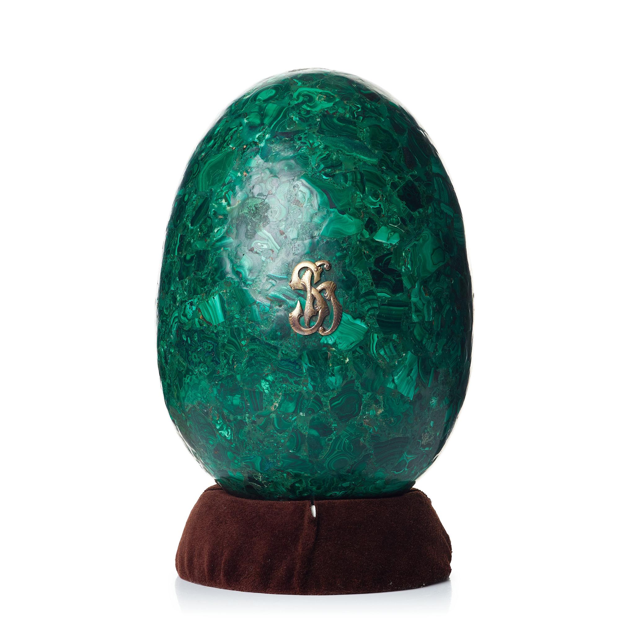 A Russian 19th Century malachite veneered egg.