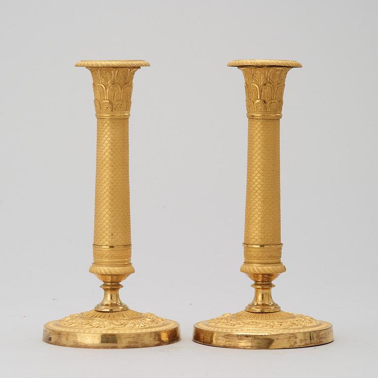 A pair of French Empire 19th century candlesticks.