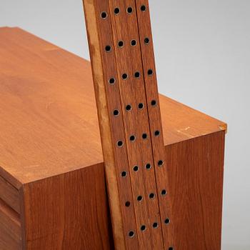 A 1960's teak shelving system by Poul Cadovius.