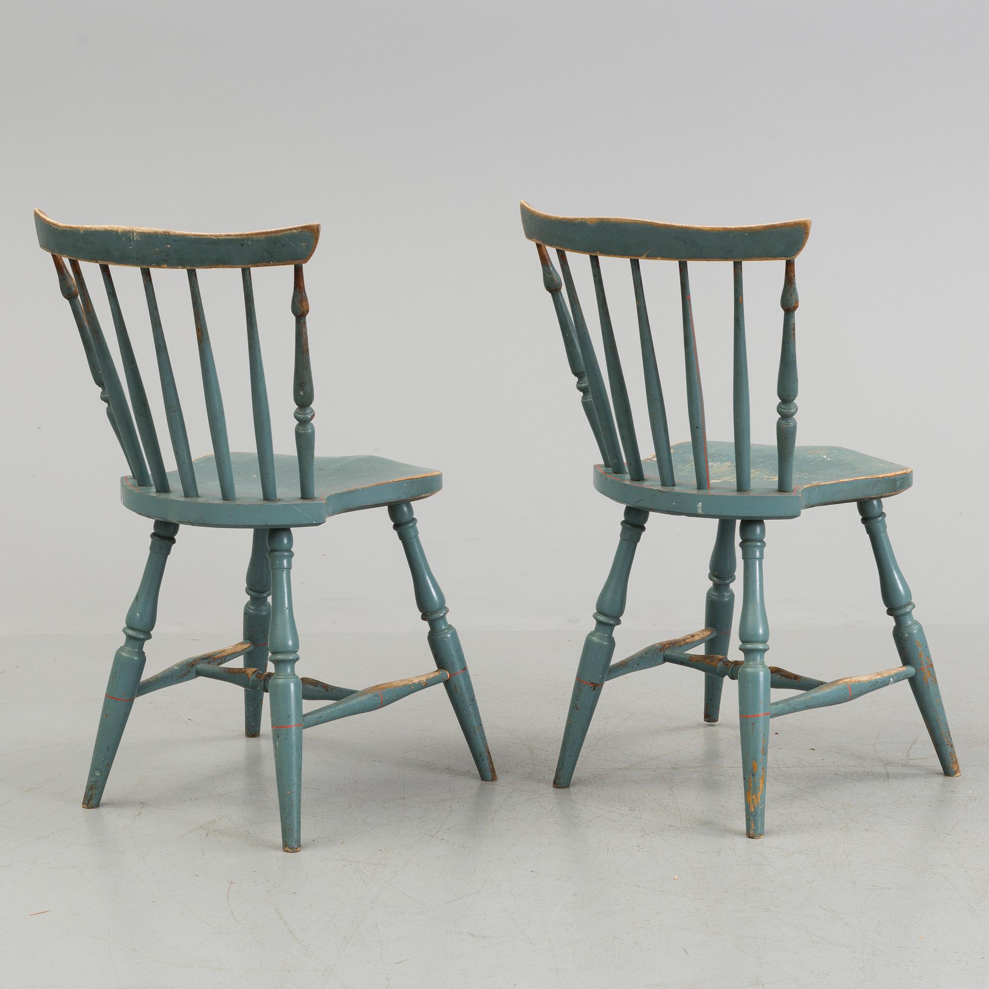 A pair of late 19th century painted chairs.
