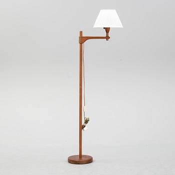 A late 20th century pine wood floor lamp design Carl Malmsten, Sweden.